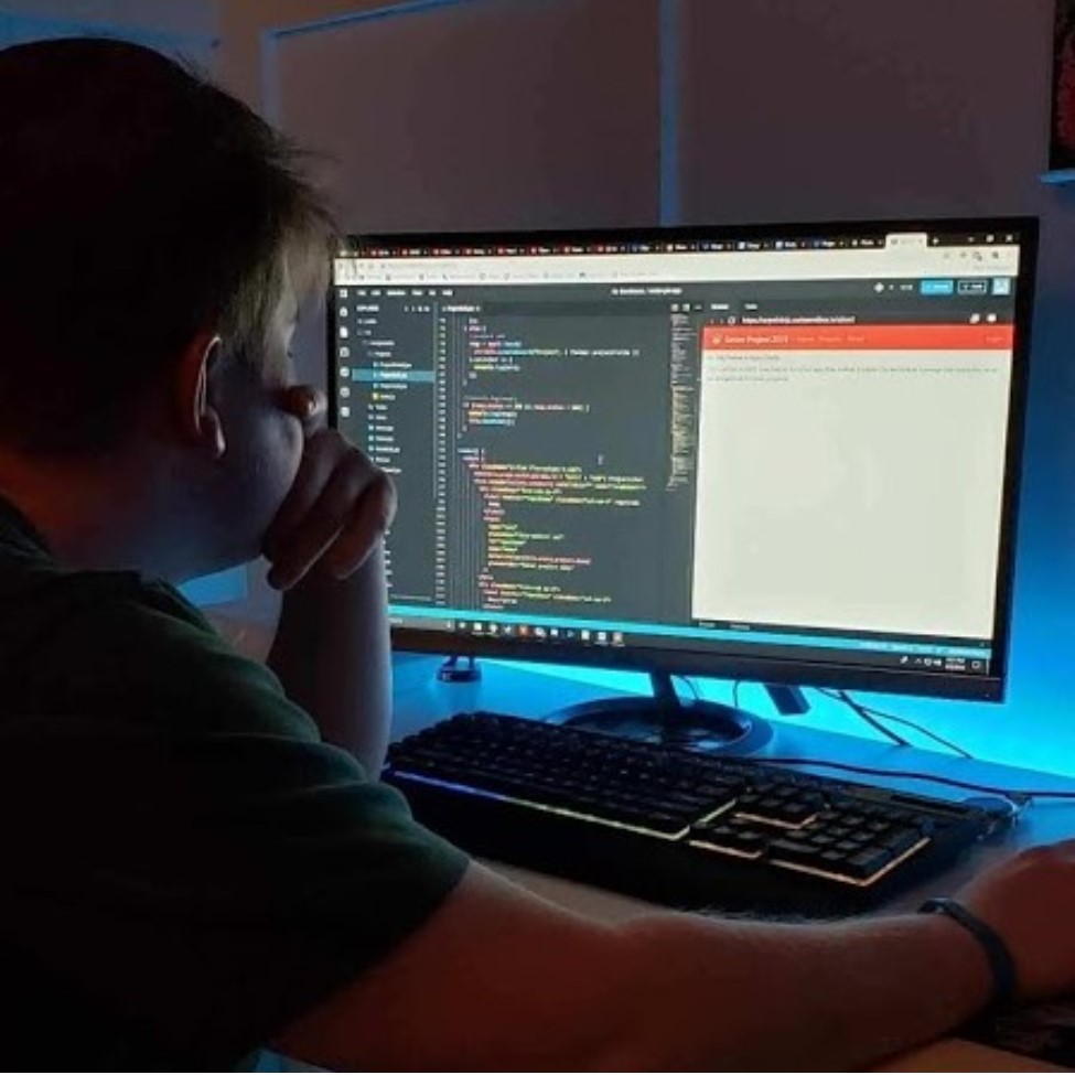 A picture of me working on my senior project in HS.
